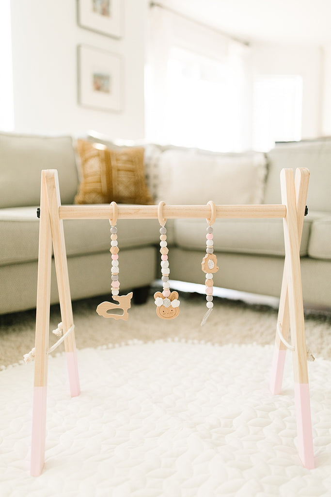 baby pink wooden play gym